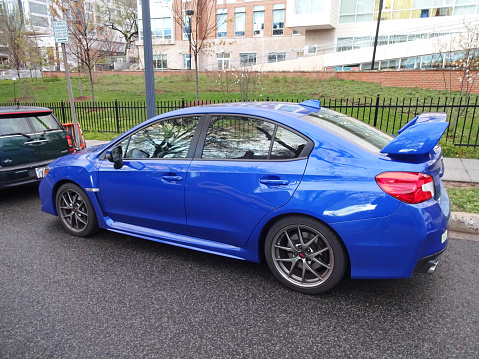 Washington DC, USA-April 7, 2016:  This Subaru WRX STI Sports Sedan was spotted in Northwest Washington DC.  Standard equipment is a 2.5 liter turbo four cylinder engine.  Performance is very good.  Fuel economy is 17 mpg city and 23 mpg highway.  Prices start at $34695.