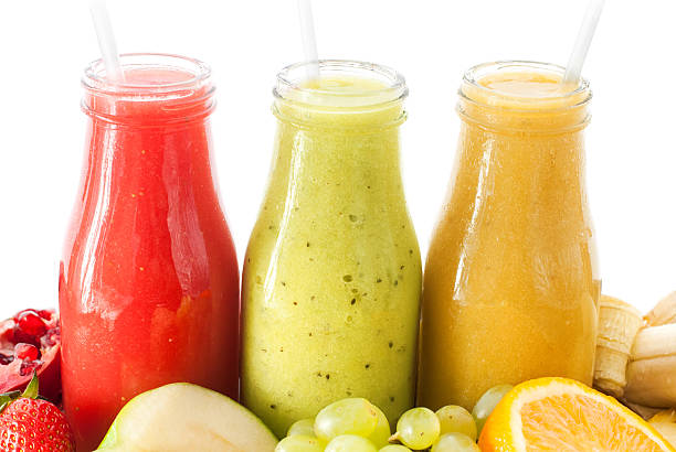 istock Row Juices Smoothie Three Bottles Red Green Orange 519579842