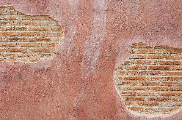 istock old rough wall made of brick and cement 519579910