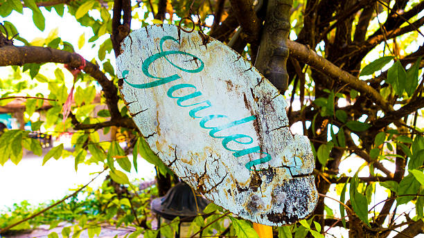 istock old garden sign with nature background 519581920