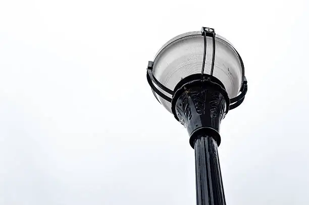From below, looking up, a beautiful street lamp