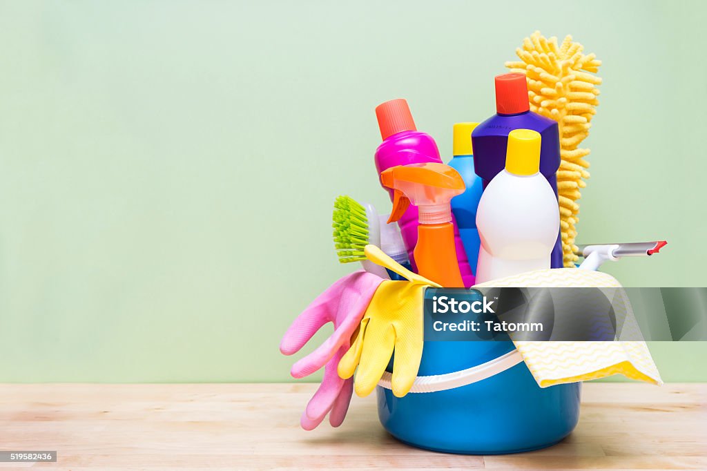 House cleaning product on wood table with green background Cleaning Product Stock Photo