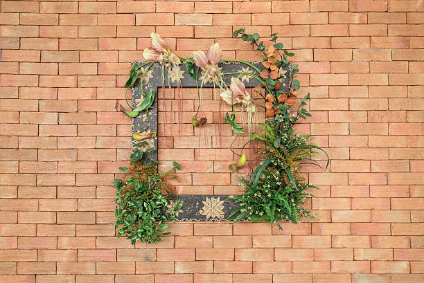 zdjęcie ramy z kwiaty i rośliny na ściana z cegły ozdobne - red poppies audio zdjęcia i obrazy z banku zdjęć