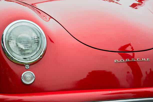 Close up view of a head light on a vintage car.