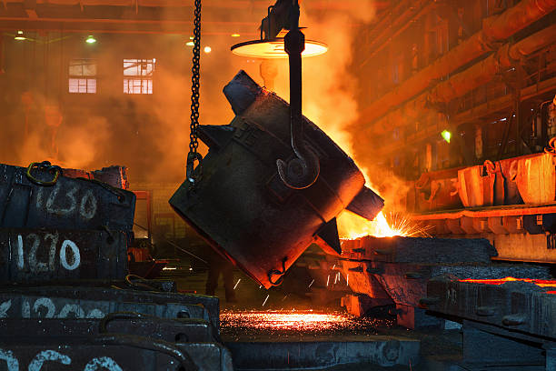 Metallurgical plant, hot metal casting. Ladle the hot metal. molten stock pictures, royalty-free photos & images