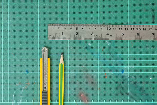 istock Cutter wood pencil and ruler on green rubber pad background 519583980
