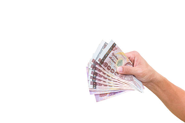 istock Hand with money isolated on a white background 519584056