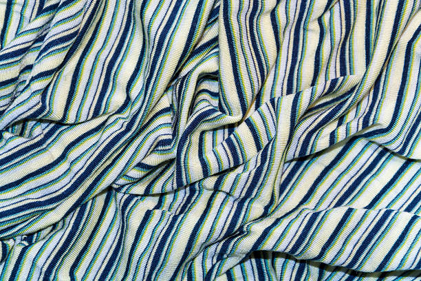 knitted fabric draped in black, yellow stripes