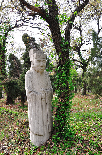 statue in shakespeare garden, huntington botanical garden, california, trees, weathered marble, classical art