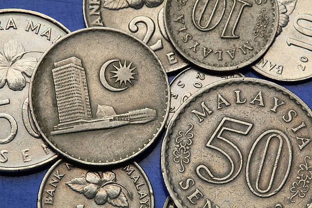 Coins of Malaysia Coins of Malaysia. Malaysian Houses of Parliament at the Lake Gardens in Kuala Lumpur depicted the Malaysian sen coins. coins of ringgit of malaysia stock pictures, royalty-free photos & images