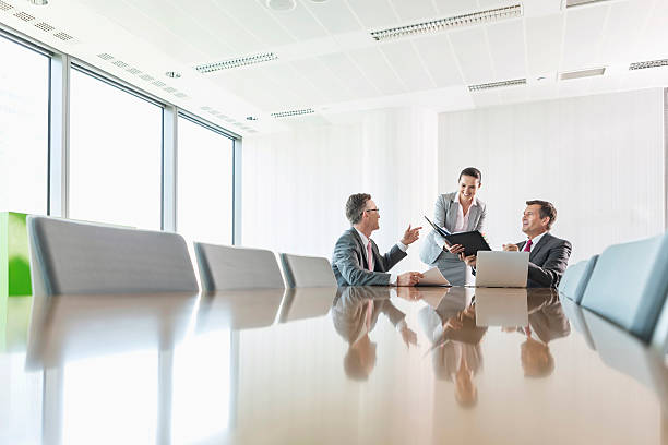istock Midsection of young businesswoman using copy machine in office 519587207