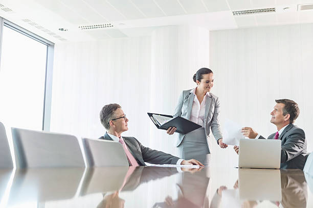 istock Cropped image of businesswoman using copy machine in office 519587209
