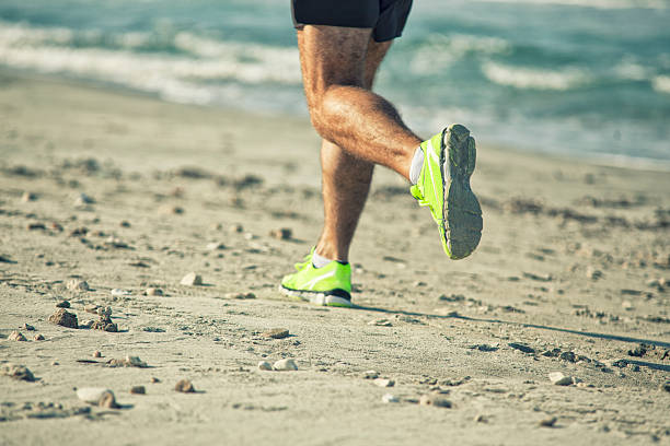 istock running outdoor on seaside beach 519587981