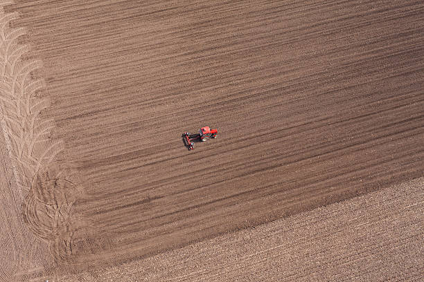 istock aerial view of  tractor on harvest field 519588012