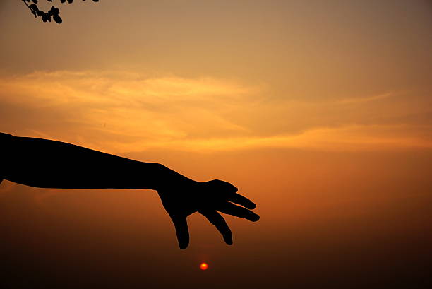 istock silhouette of a boy hand playing at sunset 519588764