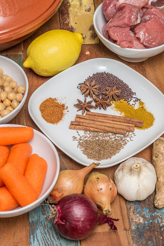 Ingredients for a Moroccan tagine dish with chick peas, lamb, carrots, lemon, onion, cinnamon, star anise