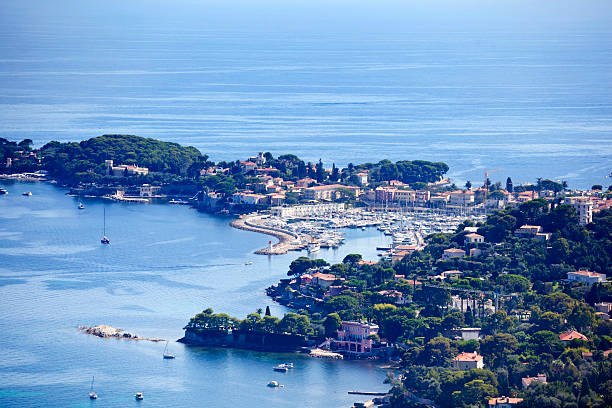 St Jean Cap Ferrat Peninsula Cap Ferrat Peninsula, the home of many rich and wealthy inhabitants on the French Riviera.The resort and port of St Jean Cap Ferrat village is located on the peninsula. Good copy space. pinus pinea photos stock pictures, royalty-free photos & images
