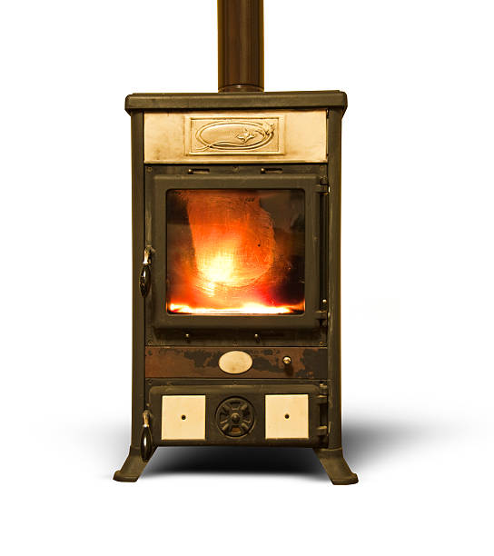 istock Ancient wood  burning stove with fire isolated on white background 519591547