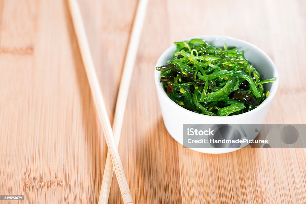 Fresh made Kelp Salad Fresh made Kelp Salad (close-up shot) on wooden background Algae Stock Photo