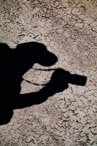 istock Photographer photographing his own shadow. 519609744