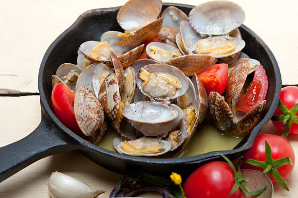 istock fresh clams on an iron skillet 519610082