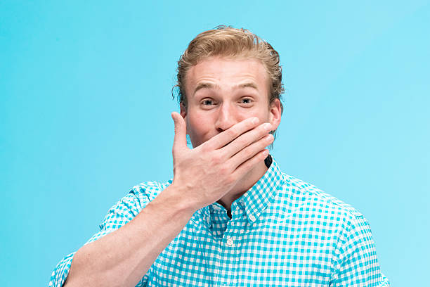 istock Man covering his mouth 519610758