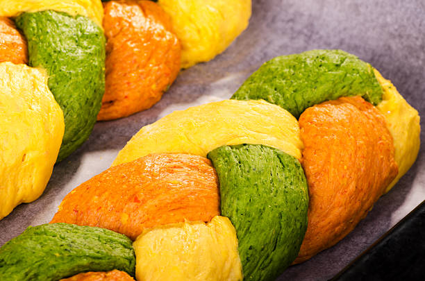 istock Beautiful bright bread in the form of braids 519611104