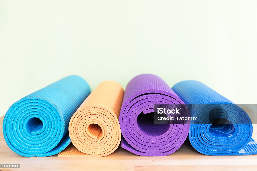 yoga mats on the table Exercise Mat Stock Photo