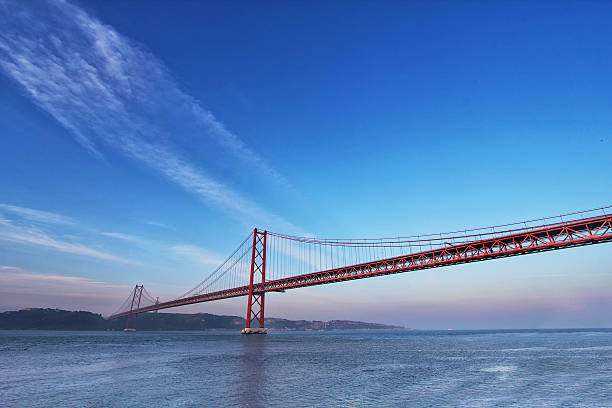 istock Red bridge at sunset, Lisbon, Portugal 519615960