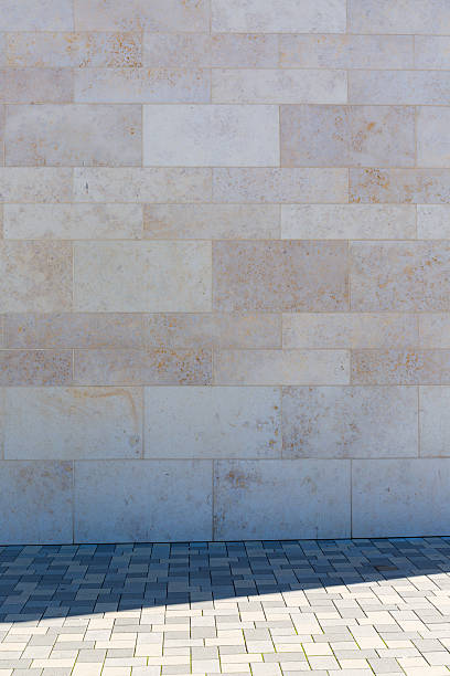 istock Stone wall and pedestrian path in the shade, picture background 519616292