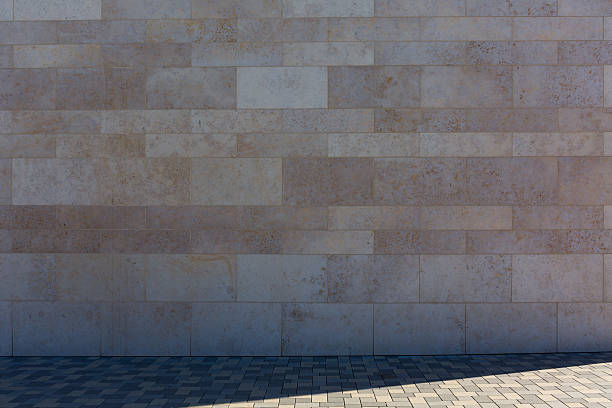 istock Stone wall and pedestrian path in the shade 519616338