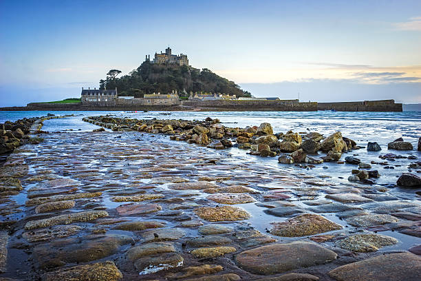 St Michaels Mount Cornwall Dusk on the causeway leading to St Michaels Mount off the coast of Marazion Cornwall England UK marazion photos stock pictures, royalty-free photos & images