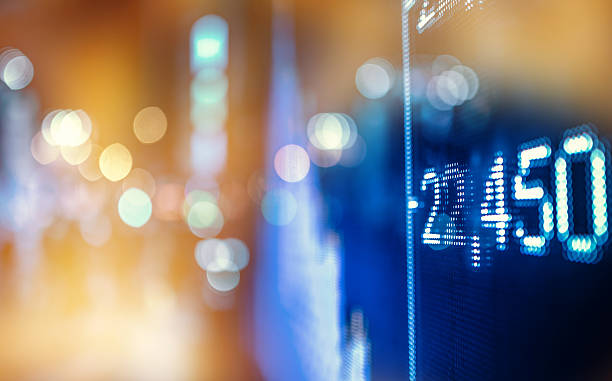 istock display stock market numbers with defocused lights background 519618244