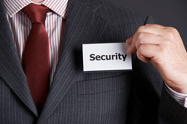 istock Businessman Attaching Security Badge To Jacket 519619219