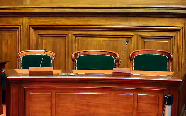 Empty vintage court's room Empty vintage court's room with table,chairs and microphones. judgement photos stock pictures, royalty-free photos & images