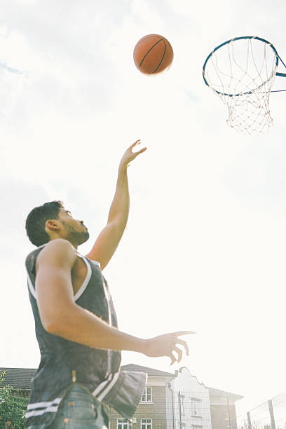 istock Basketball Player On The Court, Slam Dunking Ball 519620056