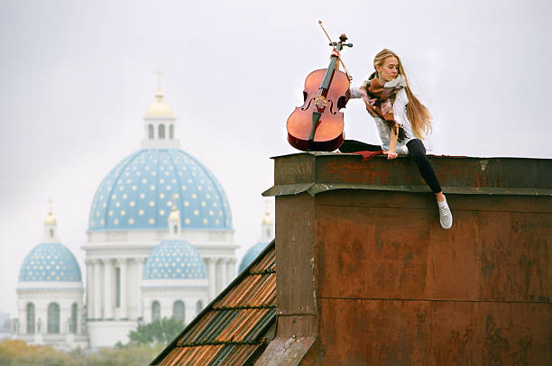 musician on the rooftop stock photo