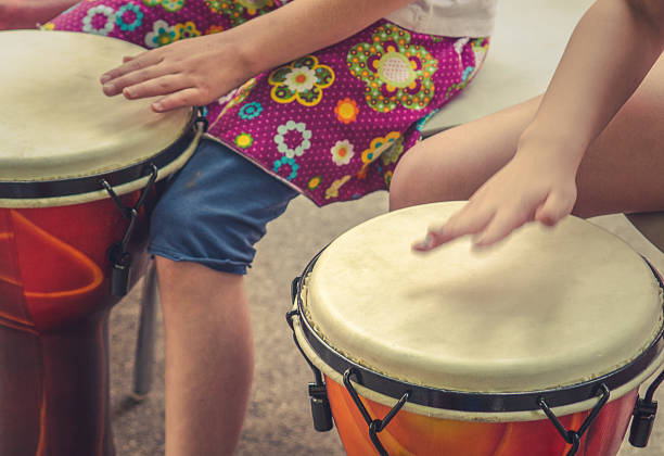 Children Drumming Action Music Shot Of Children Drumming drum percussion instrument stock pictures, royalty-free photos & images