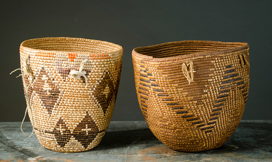 The set of old wicker straw vases isolated on white background