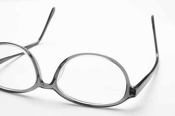 istock Female eyeglasses macro detail over a white background 519621294