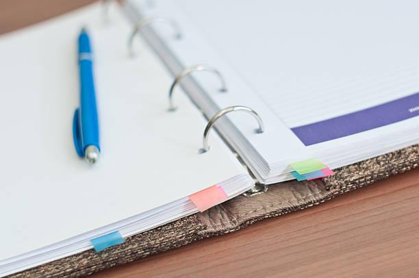 istock personal organizer and pen on office desk 519621927