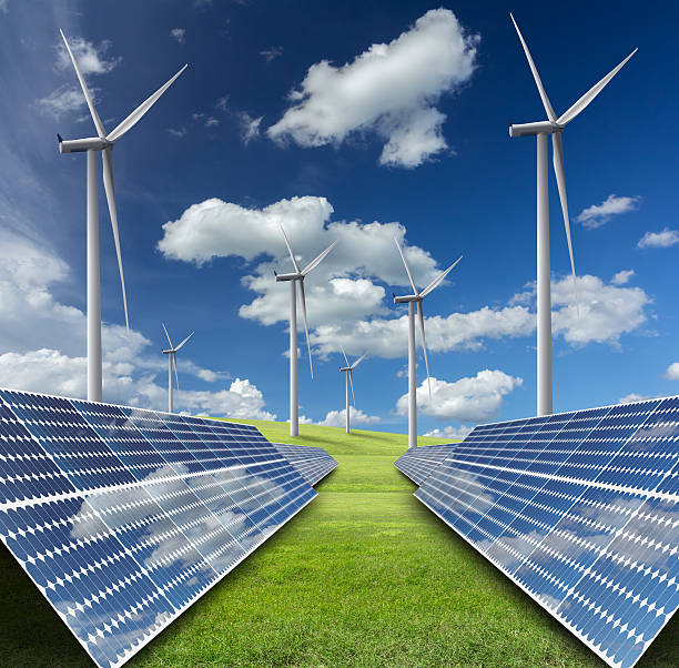 istock solar energy panels and wind turbine against blue sky 519623003