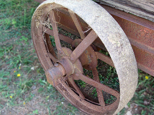 istock rusty iron wheel of old cart 519623269