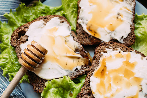 istock Sandwich from rye bread, soft cheese, fresh salad 519624156