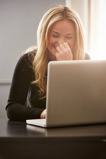 istock Young woman working on laptop 519624354