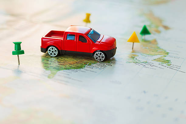 istock Road trip, car goes on map across territory of USA. 519624366