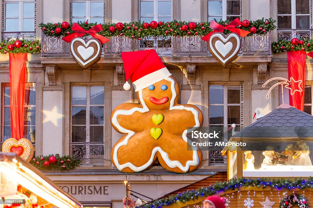 Giant Gingerbread Man Giant gingerbread man decoration attached to a facade on a public building in Strasbourg, France Christmas Stock Photo