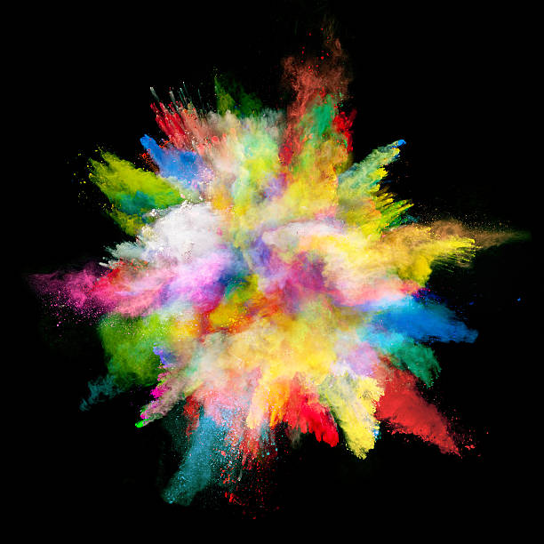 istock Explosion of colored powder on black background 519624582