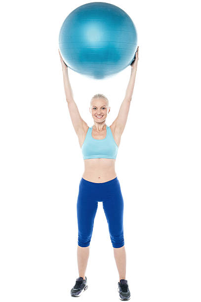 istock Woman exercising with gymnastic ball 519625503