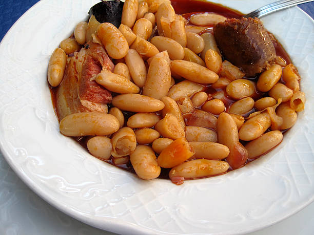 Fabada stew regional Spanish Bean stew and sausage, bacon and pork meat.Typical food of the city of Asturias, Northern Spain. fabes stock pictures, royalty-free photos & images
